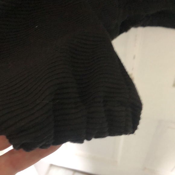 Black horizontal ribbed top with standout gold ring zipper on neckline. - Picture 5 of 6